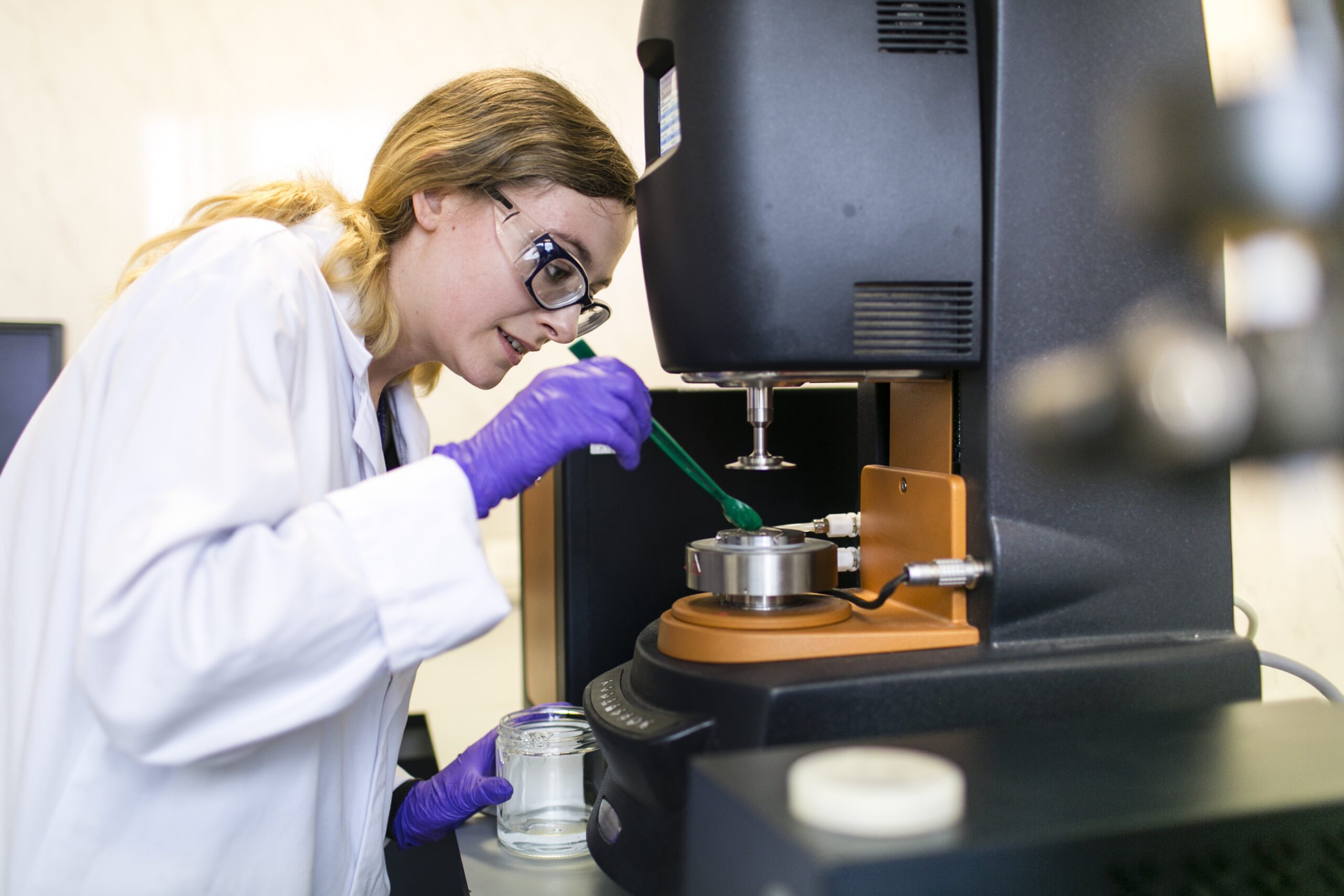 Scientist performing formulation characterization testing for topical and transdermal drug products