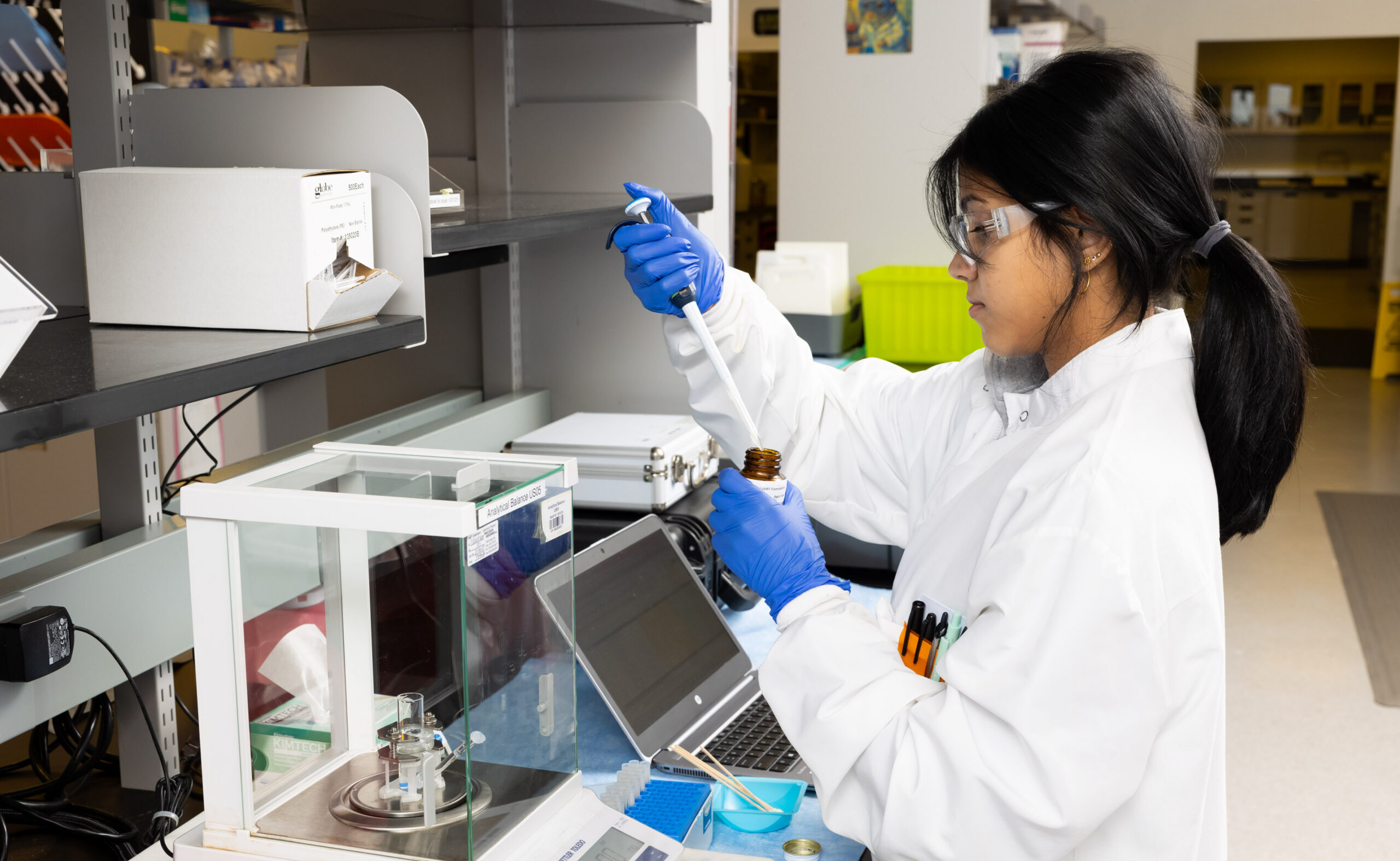 Scientist performing bioanalytical services and sample analysis in a pharmaceutical laboratory