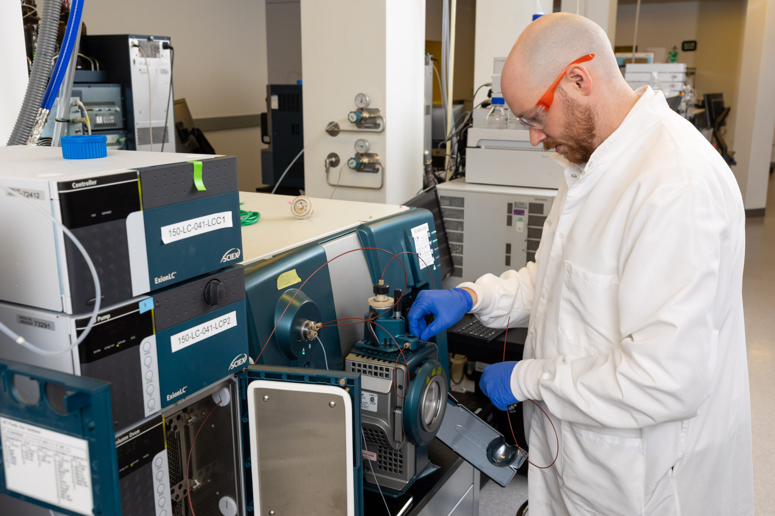 Scientist performing bioanalytical services using LC-MS/MS instrumentation in a pharmaceutical laboratory. Scientist performing in vitro release and permeation testing (IVRT/IVPT) using diffusion cells in a pharmaceutical laboratory
