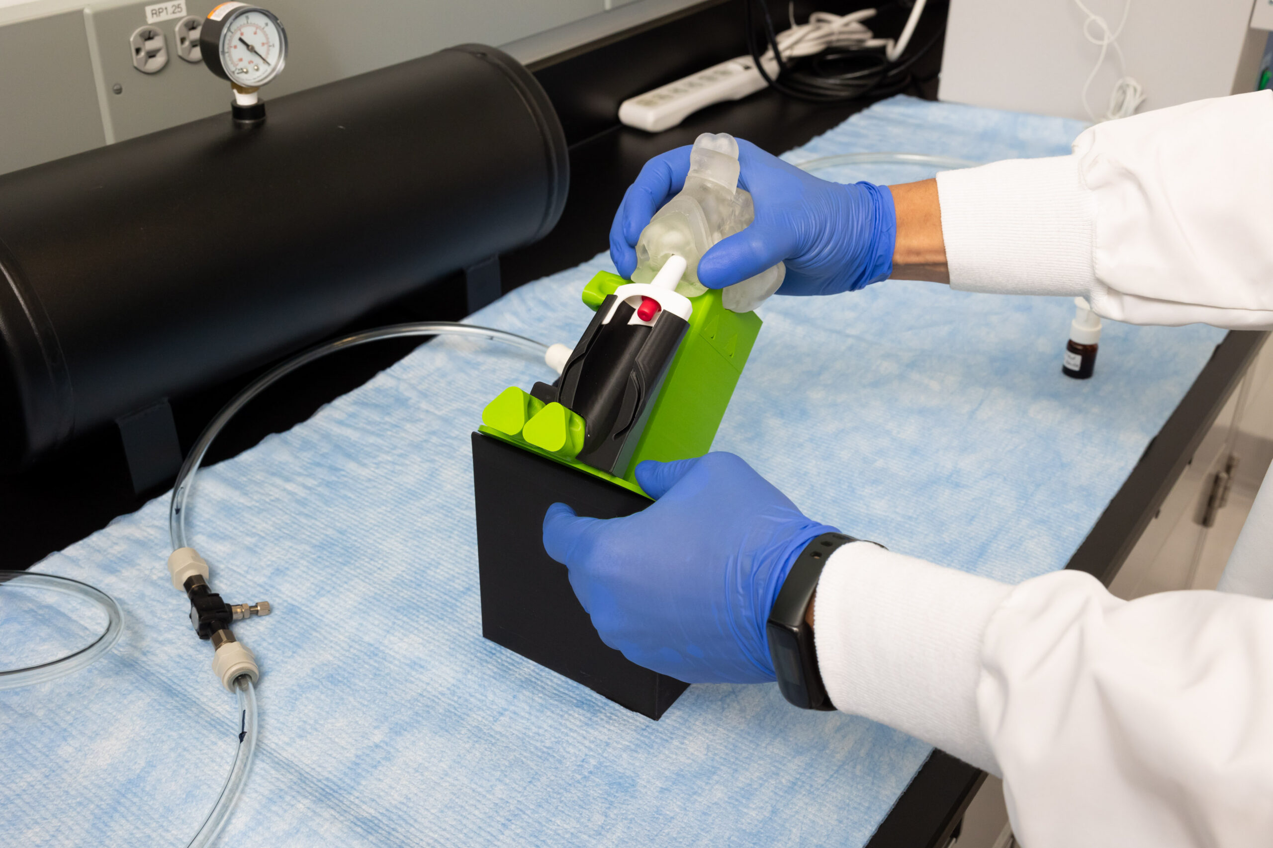 Scientist using MedCast nasal model for respiratory drug delivery testing