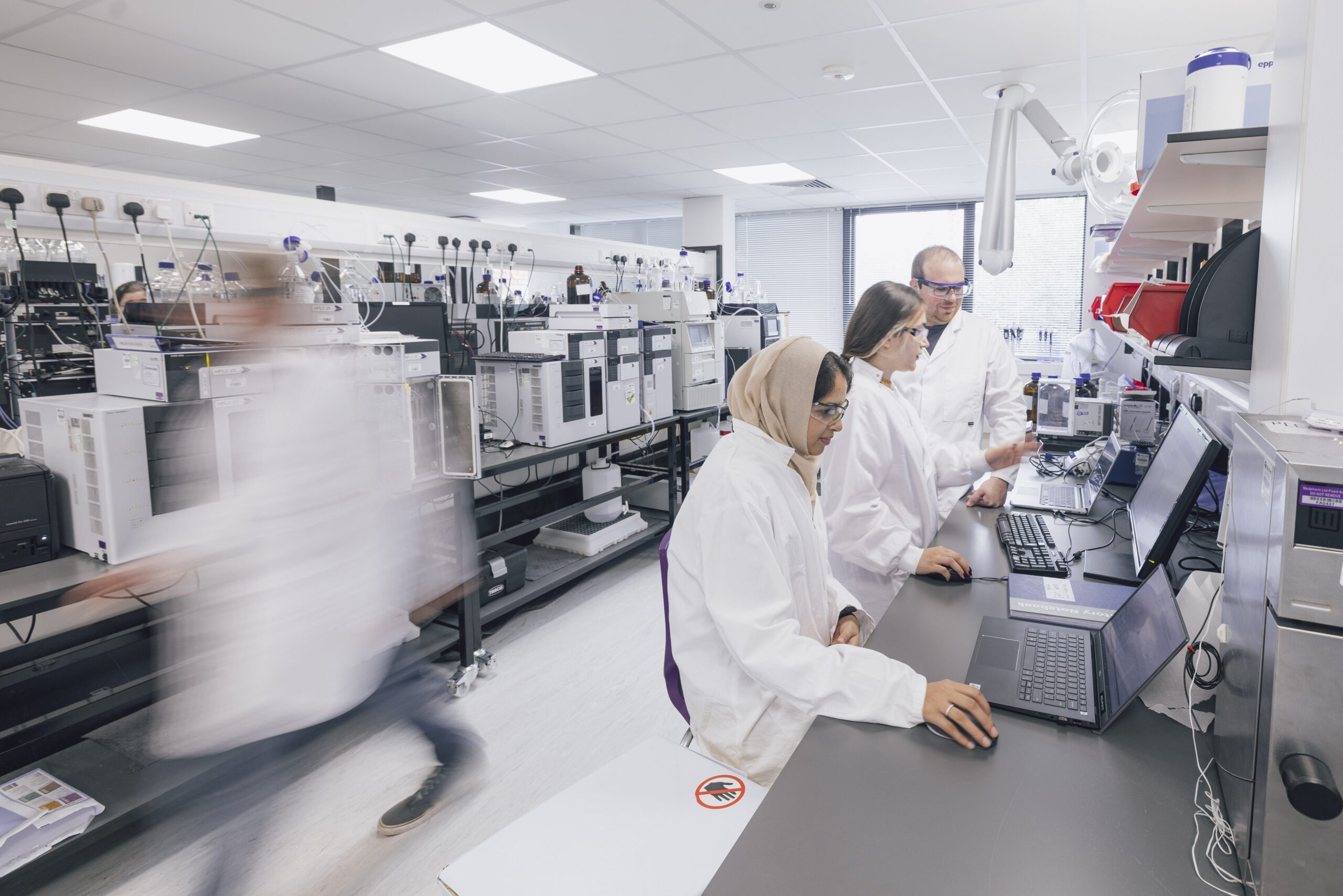 pharmaceutical laboratory team performing analytical testing